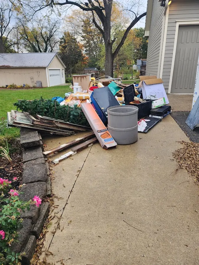 Dumpster being loaded with debris for Estate Cleanout Dumpster Rental in Dublin